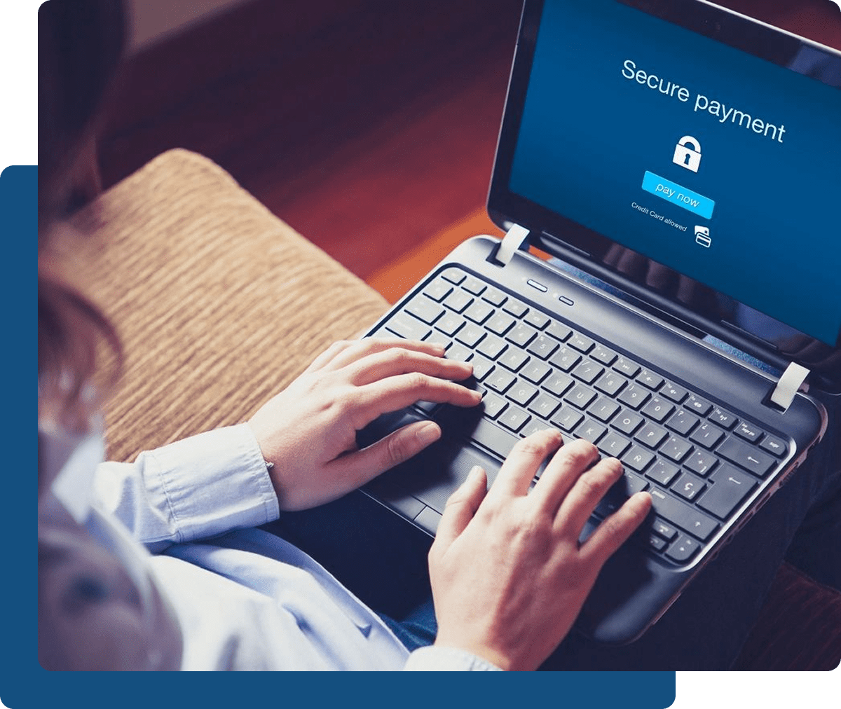 Person using a laptop displaying a "Secure payment" screen prompt with a pay now button.